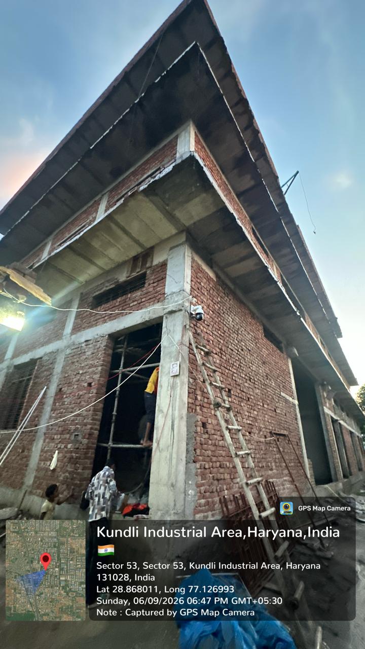 Industrial building construction with a mounted PTZ camera — Haryana Dust Portal project